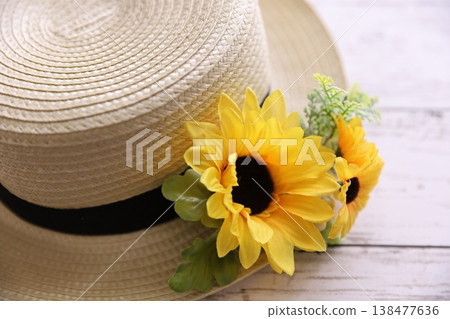 Summer flowers and straw hats Summer flowers and straw hats 138477636