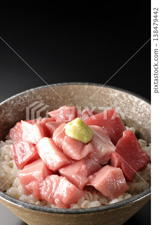 A bowl of diced tuna photographed alone against a black background. A bowl of diced tuna photographed alone against a black background. 138479442