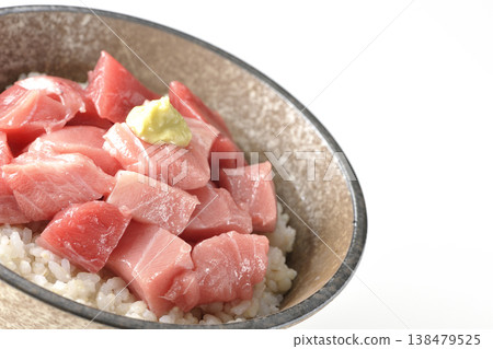 A bowl of diced tuna photographed alone against a white background. A bowl of diced tuna photographed alone against a white background. 138479525