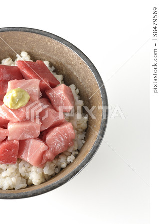 A bowl of diced tuna photographed alone against a white background. A bowl of diced tuna photographed alone against a white background. 138479569