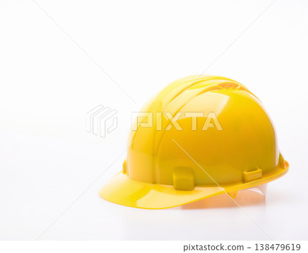 Studio photography of work helmets against a white background; protective equipment material usable at construction sites and for safety measures. 138479619