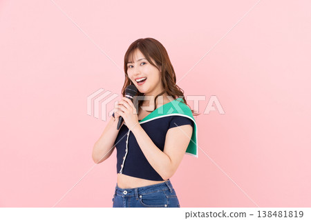 Young woman singing karaoke Young woman singing karaoke 138481819