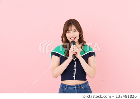 Young woman singing karaoke Young woman singing karaoke 138481820