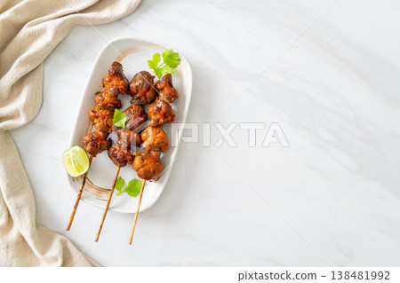 grilled chicken gizzard skewer with herbs and spices 138481992