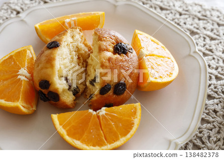 Orange and dried fruit muffin plate 138482378