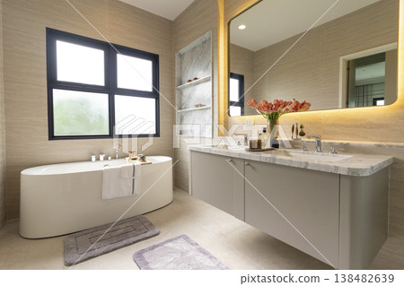 Bathroom interior, modern spacious white bathtub by the window. 138482639
