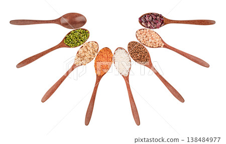 Set of different cereals in wooden spoons isolated on white background Set of different cereals in wooden spoons isolated on white background 138484977