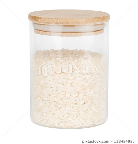 Rice in a glass jar with a wooden lid, isolated on white background Rice in a glass jar with a wooden lid, isolated on white background 138484983
