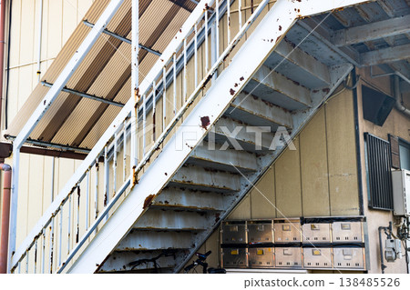 Painting work on the common staircase of an apartment building. Painting work on the common staircase of an apartment building. 138485526