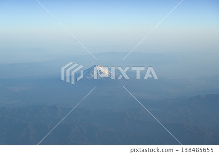 Mount Fuji with its snow-capped peak as seen from the sky 138485655