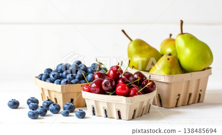 Rustic cardboard punnets brimming with blueberries dark cherries and green pears showcasing a sustainable eco-friendly harvest that celebrates local flavor and balanced wellness. 138485694