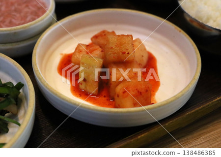 Korean radish kimchi cubes served with spicy sauce Korean radish kimchi cubes served with spicy sauce 138486385