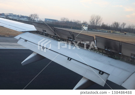 Airplane wing with spoilers during landing 138486488