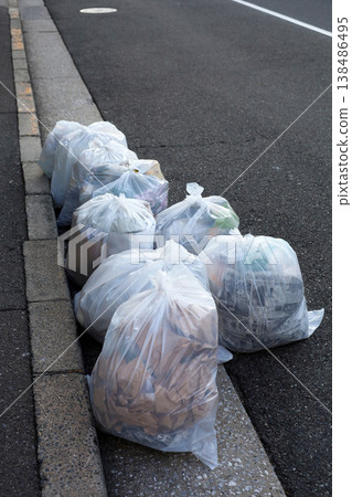 Garbage bag on urban sidewalk in Japan waiting for collection Garbage bag on urban sidewalk in Japan waiting for collection 138486495