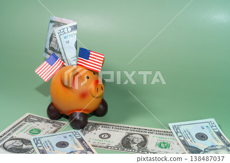 A cheerful piggy bank adorned with American flags is surrounded by US currency on a green backdrop, symbolizing savings and finance. A cheerful piggy bank adorned with American flags is surrounded by US currency on a green backdrop, symbolizing savings and finance. 138487037