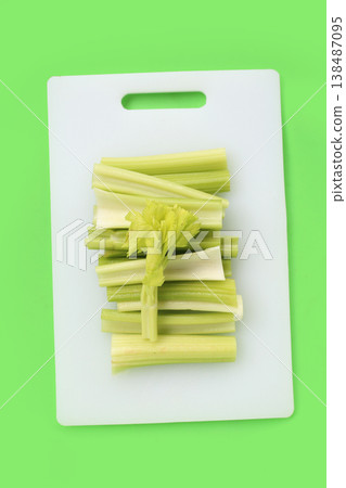 Fresh celery isolated on cutting board Fresh celery isolated on cutting board 138487095