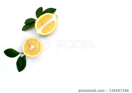 Fresh lemon with green leaves on white. Fresh lemon with green leaves on white. 138487166