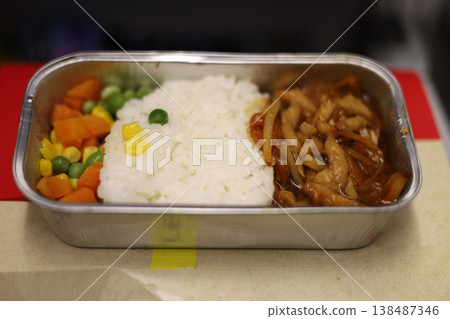Airline meal with rice chicken sauce and mixed vegetables Airline meal with rice chicken sauce and mixed vegetables 138487346