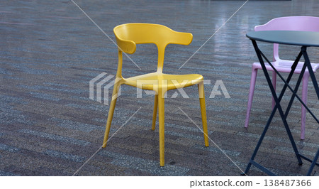 Colorful outdoor chairs and tables in urban public plaza 138487366