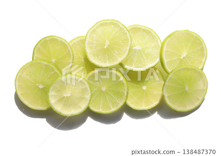 Fresh green lime slices on whiate background. Fresh green lime slices on whiate background. 138487370
