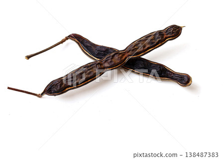 Dried rain tree pods isolated on white background 138487383