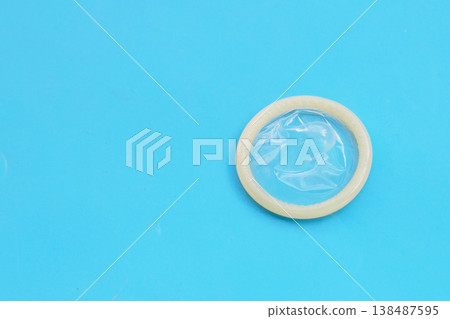 Condom on a blue background. Condom on a blue background. 138487595