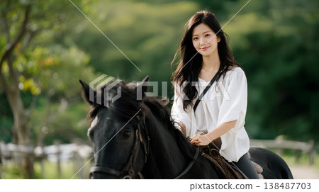 Women riding a horse 138487703