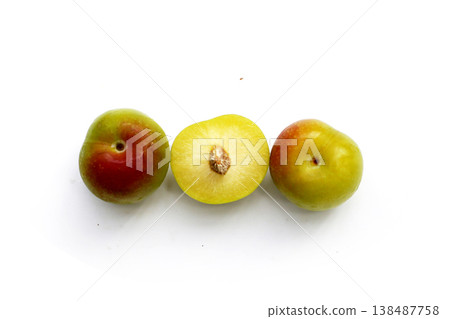 Fresh green plum fruit on white background. Fresh green plum fruit on white background. 138487758