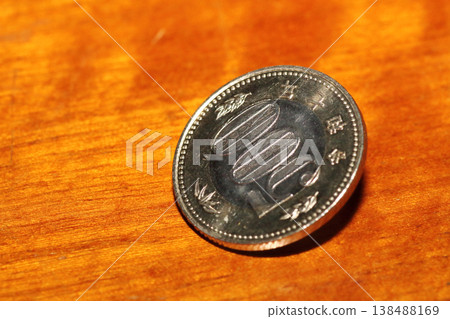 Close-up of a 500 yen coin standing upright Close-up of a 500 yen coin standing upright 138488169