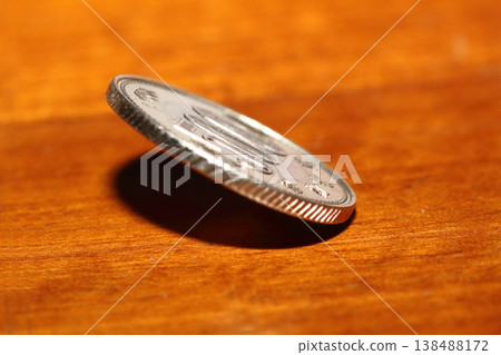 Close-up of a 500 yen coin standing upright Close-up of a 500 yen coin standing upright 138488172