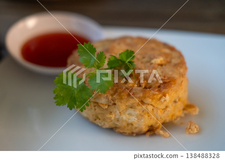 Omelet with crab meat served with sauce, on plate Omelet with crab meat served with sauce, on plate 138488328