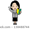 A female office worker with a one-curl bob haircut looks embarrassed holding a beginner driver's sticker. 138488744