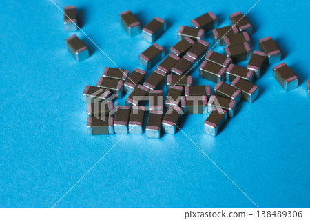 Surface mount ceramic capacitors on blue background Surface mount ceramic capacitors on blue background 138489306