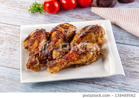 Baked chicken drumsticks with spices Baked chicken drumsticks with spices 138489562