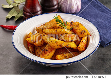 Baked crispy hot potato with rosemary Baked crispy hot potato with rosemary 138489710