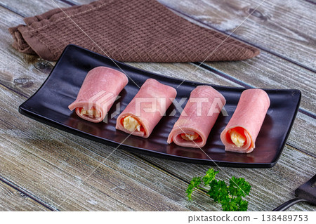 Wrapped ham and cheese roll Wrapped ham and cheese roll 138489753