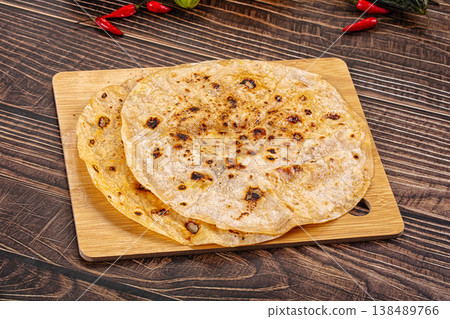 Toasted flatbread with fresh vegetables and chili peppers Toasted flatbread with fresh vegetables and chili peppers 138489766
