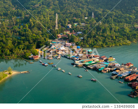 Top down aerial view of wooden houses and walkways in Bang Bao village, Thailand. Unique coastal architecture. Top down aerial view of wooden houses and walkways in Bang Bao village, Thailand. Unique coastal architecture. 138489808