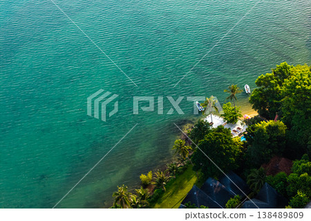 High angle aerial view of coral reefs under crystal clear turquoise water in Ko Chang, Thailand. Tropical sea bottom. 138489809