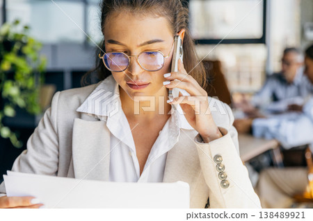 Operations director finalizing contract details on call 138489921