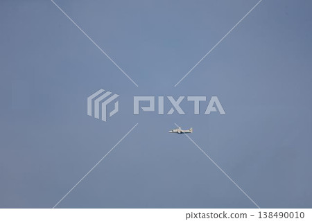 A small passenger plane takes off over Chofu Airport. 138490010