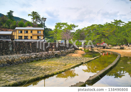 Bridge and stone wall over a waterway Bridge and stone wall over a waterway 138490808