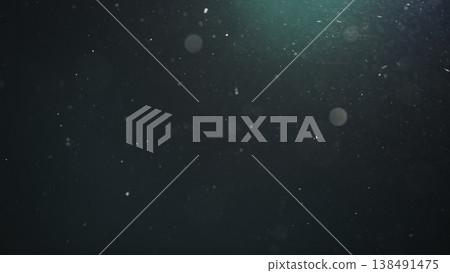Real dust particles floating in air over dark background Real dust particles floating in air over dark background 138491475