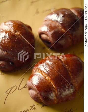 Chocolate butter roll bread, high angle Chocolate butter roll bread, high angle 138491843
