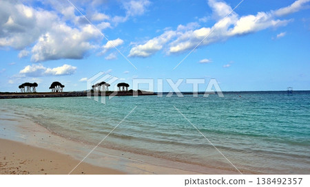 Blue skies and clouds stretching across the blue sea and sandy beaches of Okinawa 138492357