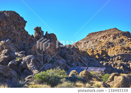 Solar Panels Among Rugged Rocks and Blue Sky in California Desert Landscape Solar Panels Among Rugged Rocks and Blue Sky in California Desert Landscape 138493339