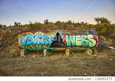 Graffiti Covered Tank in Mojave Desert California with Abandoned Industrial Vibe Graffiti Covered Tank in Mojave Desert California with Abandoned Industrial Vibe 138493373