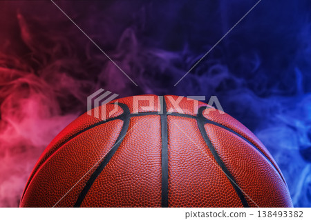 Basketball ball with red and blue smoke behind creating dynamic visual contrast for sport competition and player training concepts 138493382
