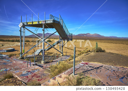 Abandoned Water Slide Platform Graffiti and Desert Landscape at Lake Dolores California Abandoned Water Slide Platform Graffiti and Desert Landscape at Lake Dolores California 138493428