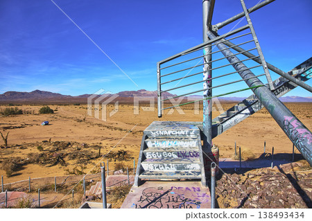 Graffiti Covered Staircase and Desert Landscape at Abandoned Lake Dolores Water Park Graffiti Covered Staircase and Desert Landscape at Abandoned Lake Dolores Water Park 138493434